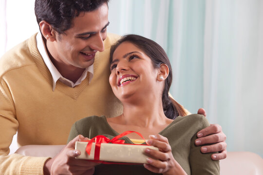 Woman receiving a gift on Valentines Day