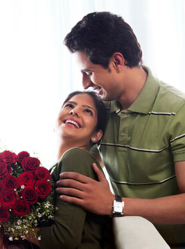 Couple with a bouquet of roses