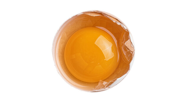 Broken brown eggshell with vibrant yellow yolk, isolated on transparent background