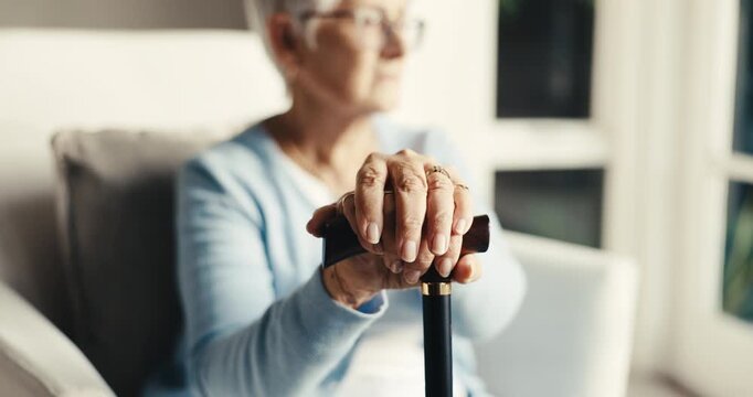 Nursing home, old woman and hands with walking stick, retirement and patient with balance in lounge. Rehabilitation, health and senior person with disability in house, healing and cane for support