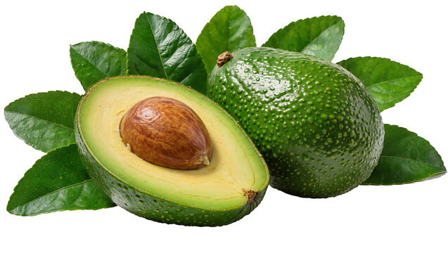 Whole and halved green avocado with large brown seed surrounded by fresh leaves, isolated on transparent background