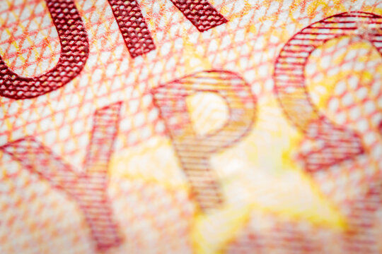 Euro currency extreme close up of 10 euro banknote. Detailed European money texture. Selective focus. Shallow depth of field. Extreme macro.