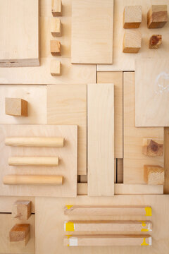 Flat lay of various wood and plywood pieces. Carpentry background.
