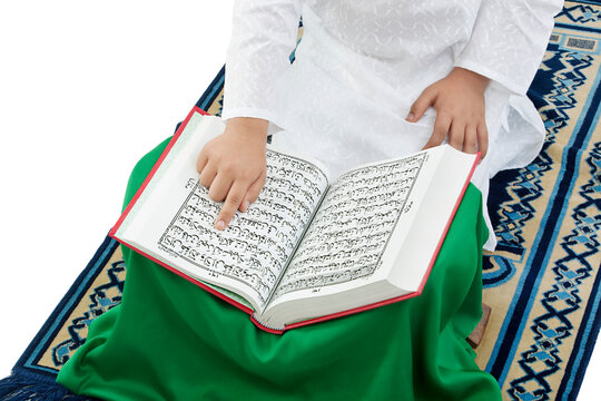 Muslim boy reading the Quran 