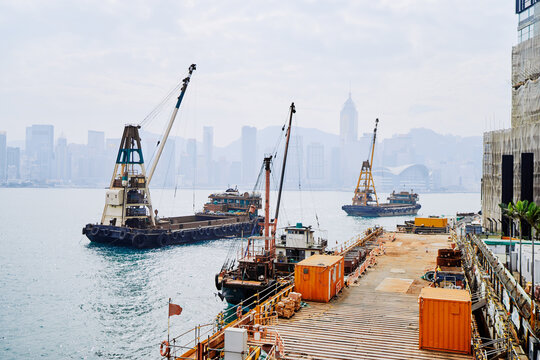 Coastal Construction Dock With Cranes Overlooking the City Skyline on a Foggy Day