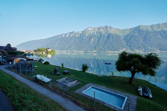 Serene Lakeside View With Mountains, Blue Sky, and Quiet Relaxation