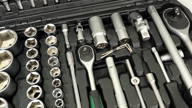 Ratchet wrench and socket set in tool case, automotive repair, vehicle maintenance and professional mechanic tools.