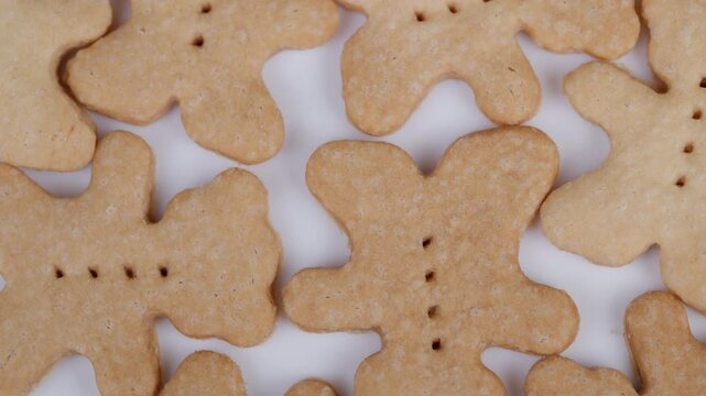 Homemade bearshaped cookies display. Cookies resembling bears scattered across surface. Softly lit closeup of homemade bear cookies with rustic charm and natural textures
