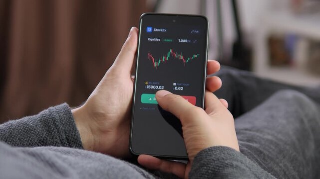Online investor follows a live chart, taps buy and completes a trade, capturing modern finance, market volatility and the growth of mobile brokerage platforms.