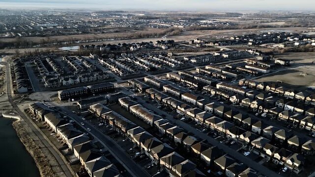 Aerial view of Barrhaven suburban housing development in Ottawa during early winter morning light. g.