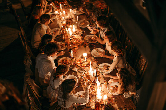 Diverse Multi Generational Family Sharing Healthy Dinner In Cozy Home Authentic Togetherness Food Lifestyle Realism Warm Lighting Happiness