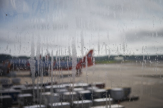 Morning Airport View Through Condensation Covered Window