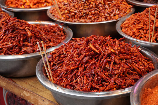 A taste of Guizhou. Bold and spicy local chili dishes at the historic Qingyan Ancient Town market, China.