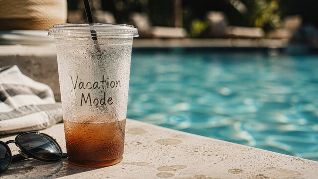 Vacation Mode Drink by Swimming Pool with Sunglasses on Sunny Summer Day