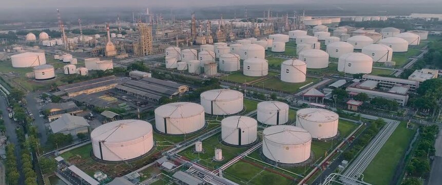 Aerial view of industrial oil storage tanks and refinery infrastructure in Cilacap Regency, Central Java, Indonesia.