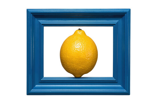 Whole glossy lemon centered in a dark blue rectangular picture frame