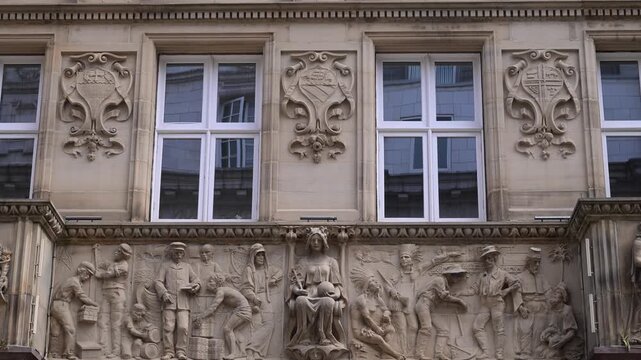 Static shot of Union Bank building stone relief panels and sash windows on Abtech House in central Leeds.