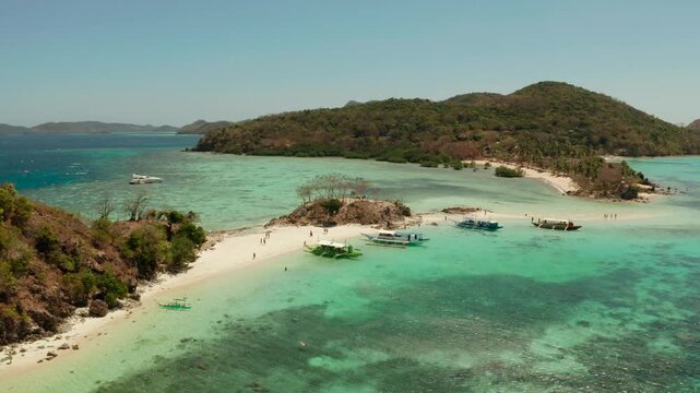 aerial seascape tropical beach with white sand and clear blue sea. tropical landscape with islands and beaches. Philippines, Palawan.