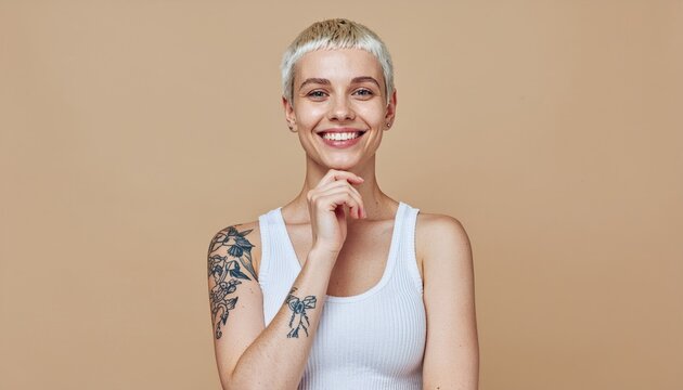  Smiling blond pretty smiling girl beauty female gen z model with short blonde hair beautiful face healthy skin and tattoo