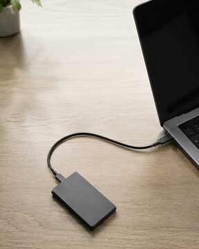 External SSD Connected to Laptop for Secure Small Business Data Backup
