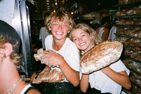 Diverse Couple Working Together In Artisan Bakery Authentic Small Business Owners Baking Fresh Sourdough Bread Warm Morning Light Teamwork Realism Unposed Healthy Food Community