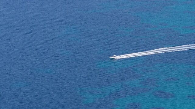 Speedboat crossing deep blue waters