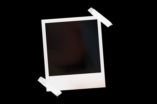 Vintage photo frame card with textured paper and adhesive tape, isolated on black JPEG background