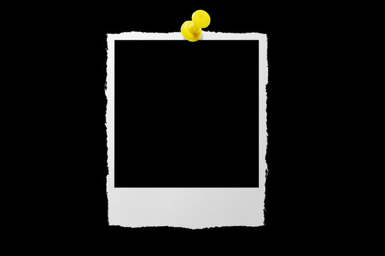 Photo card attached with a push pin isolated on a black background.