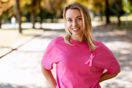 Woman wearing pink ribbon for breast cancer awareness