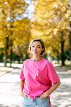Woman wearing pink ribbon for breast cancer awareness