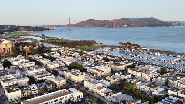 Aerial view of San Francisco's Palace of Fine Arts near the Golden Gate Bridge at golden hour. g.
