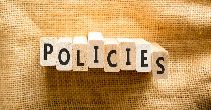 Policies word symbol. Concept word Policies on beautiful wooden blocks. Beautiful canvas background. Business support help policies word concept. Copy space.