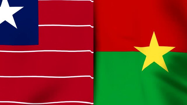 Two national flags of liberia and burkina faso waving side by side in the wind