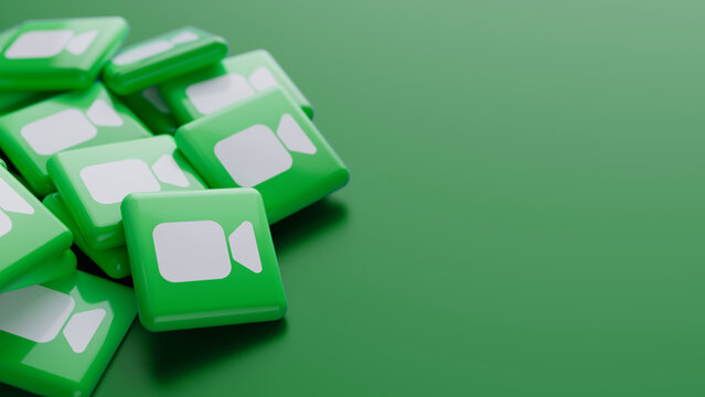 Berlin, Germany - August 14, 2026: Logo of videotelephony service Facetime in a pile on green background with copy space