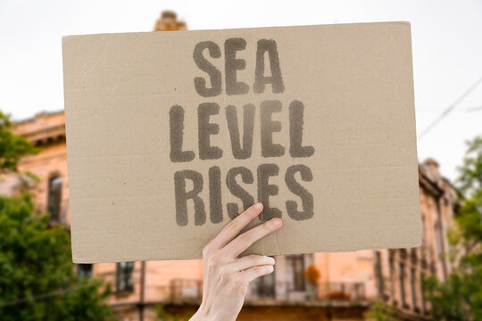 "Sea Level Rises" The ocean is a slow thief, and every millimeter is a home or a field lost. ARCTIC ICE MELT. SEA LEVEL RISE. COASTAL INUNDATION. LAND LOSS. GLOBAL IMPACT.