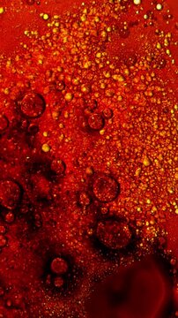 Burning Movie Film Close-Up. Macro view of film bubbling, boiling and igniting as heat destroys the surface with glowing orange and red textures.