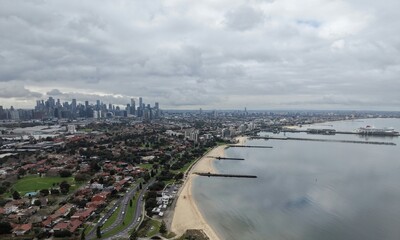 Fototapeta premium Melbourne city skyline and Port Phillip Bay aerial view
