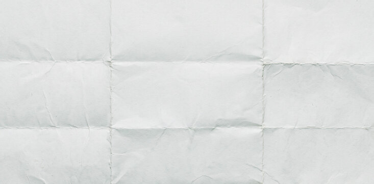 A textured white wrinkled paper background, featuring a series of creases and folds that create a soft, subtle appearance ideal for various design purposes.