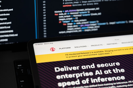 F5 Ai company web page on program code background