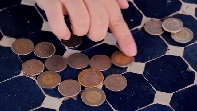 closeup Moroccan dirham money, coins on traditional table, count paper dirham banknotes, cash payments, monetary savings, save for vacation, exchange and cashing currency