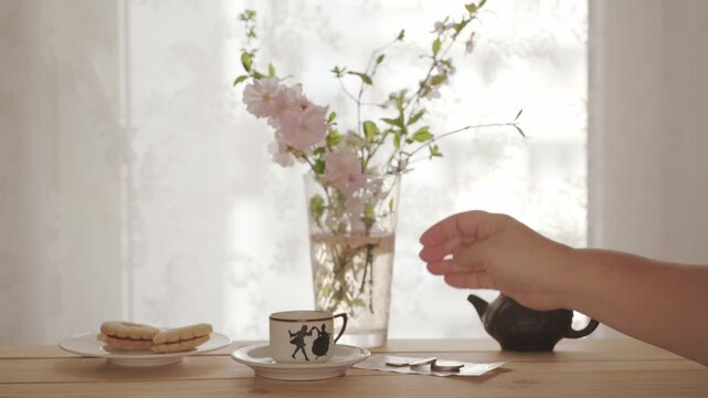 satisfied customer pays GBP bill in cash, Female hand placing pound sterling banknotes on white saucer, tipping concept, Bill settlement, dining etiquette