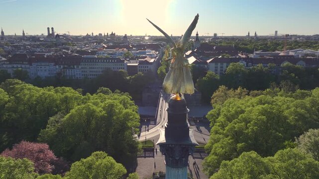 Golden Angel of Peace in Munich at sunset, Peace Memorial, Aerial Drone Shot of Friedensengel in Munchen, Germany.