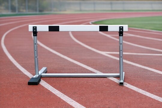 A close-up shot of a hurdle on a track, useful for sports and fitness imagery