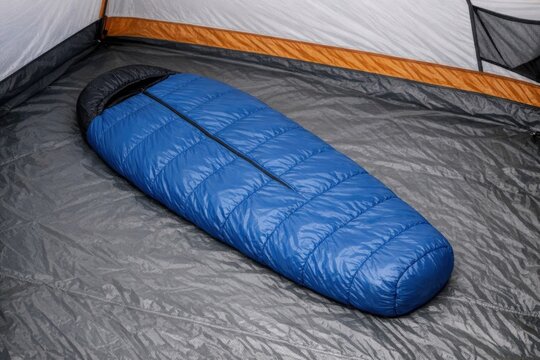 A sleeping bag inside a tent on the ground
