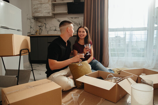 Young couple celebrating moving into new home