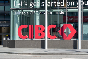 Fototapeta premium Toronto, Ontario, Canada - August 13, 2026: Exterior signage for the Canadian Imperial Bank of Commerce (CIBC) outside the office building at CIBC headquarters on Bay Street in downtown Toronto, Ontar