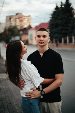 Young couple embracing outdoors feeling connected