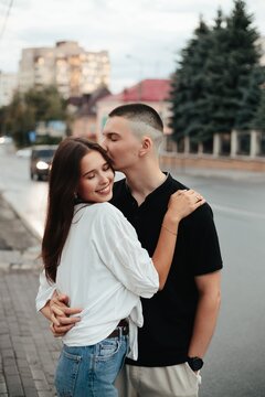 Young couple showing love and affection in city