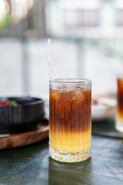 Iced bumble coffee layered drink on outdoor cafe table