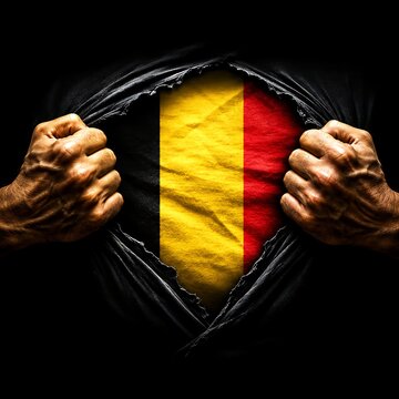 Man tearing open shirt to reveal Belgium flag, patriotic concept for sports and events